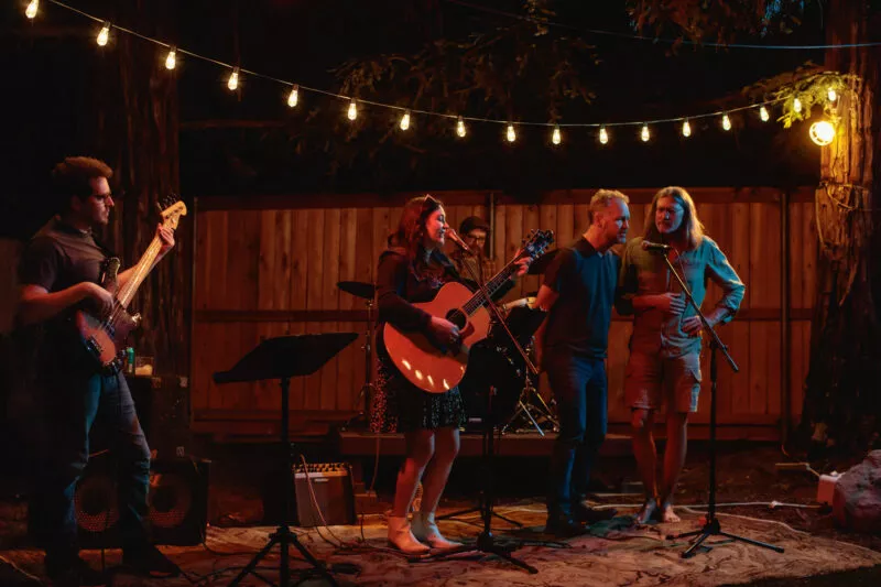 Hannah Jane Kile performing at a Listen Up backyard concert in 2022.