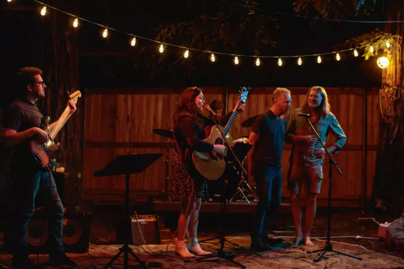 Hannah Jane Kile performing at a Listen Up backyard concert in 2022.