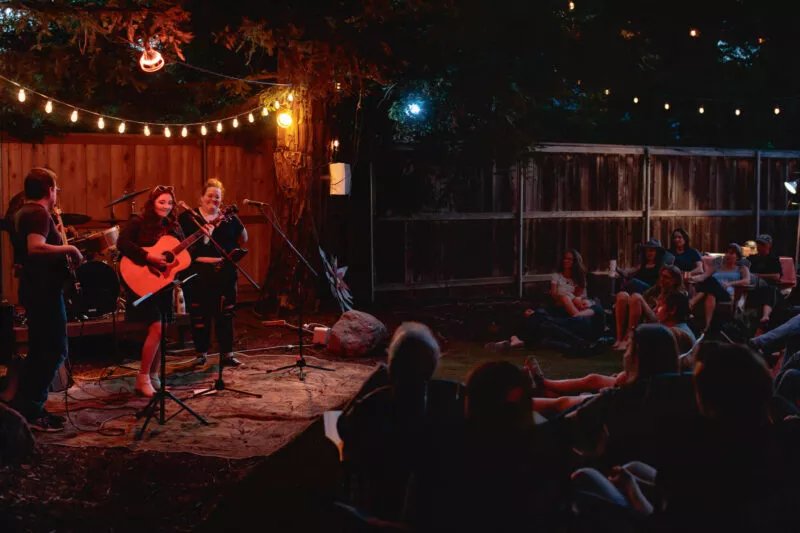 Hannah Jane Kile performing at a Listen Up backyard concert in 2022.