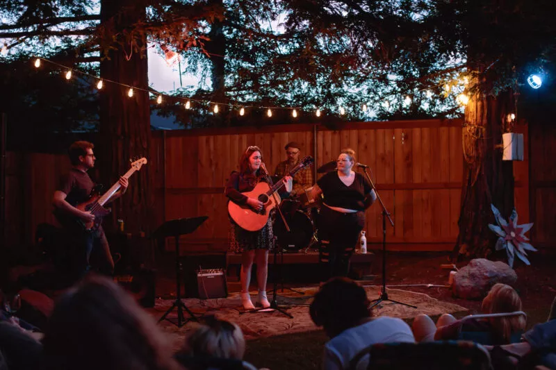 Hannah Jane Kile performing at a Listen Up backyard concert in 2022.